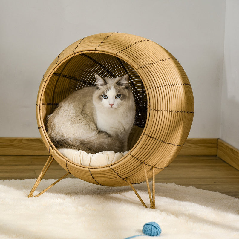 Cama elevada de mimbre para gatos PawHut, canasta elevada de ratán para gatitos, cueva acogedora con cojín suave, Φ52 x 58 cm, marrón claro